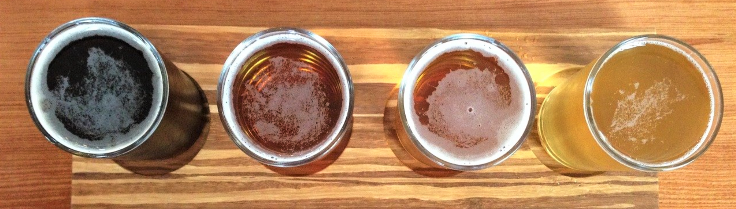 beers in glasses on a table