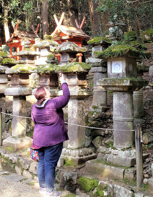 me, taking pictures at a shrine in Nara Park, Japan